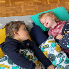 Load image into Gallery viewer, Boy and girl chatting in their Toddler Bundle Beds Camping and Sleepover Beds, in Space and Adventure Designs. The best camping and sleepover toddler bed