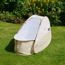 Load image into Gallery viewer, Pop Up Travel Cot with blackout cover, shown on grass
