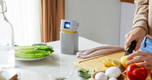 Load image into Gallery viewer, Benq GV1 Portable Camping Projector whilst cooking