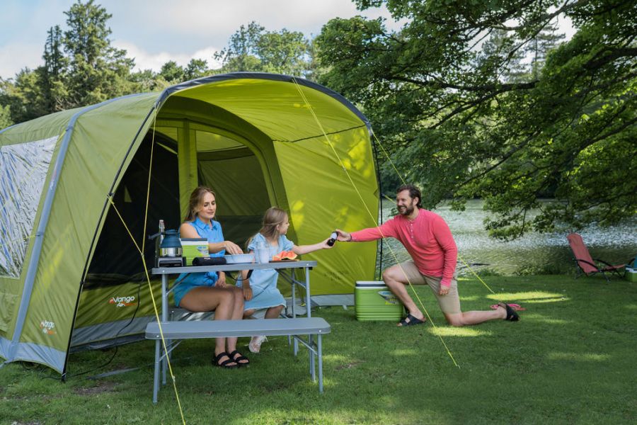 Family sat outside a Vango Avington Flow Air 500 Best 5 Person Family Ait Tent at Kids Camping Store 