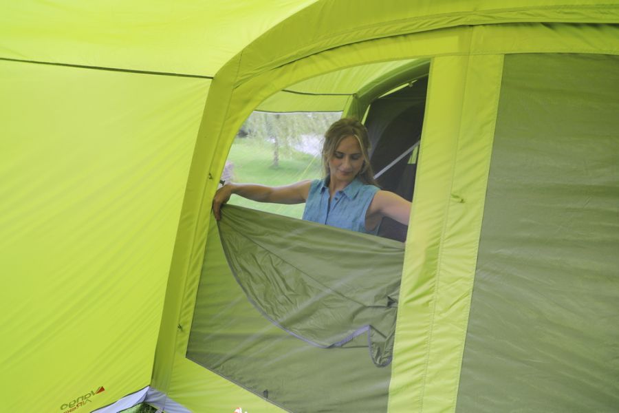 Mum inside a Vango Avington Flow Air 500 Best 5 Person Family Ait Tent at Kids Camping Store 