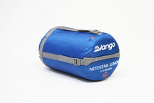 Load image into Gallery viewer, Angled view of Vango Nitestar Junior Children&#39;s Sleeping Bag in Classic Blue in bag

