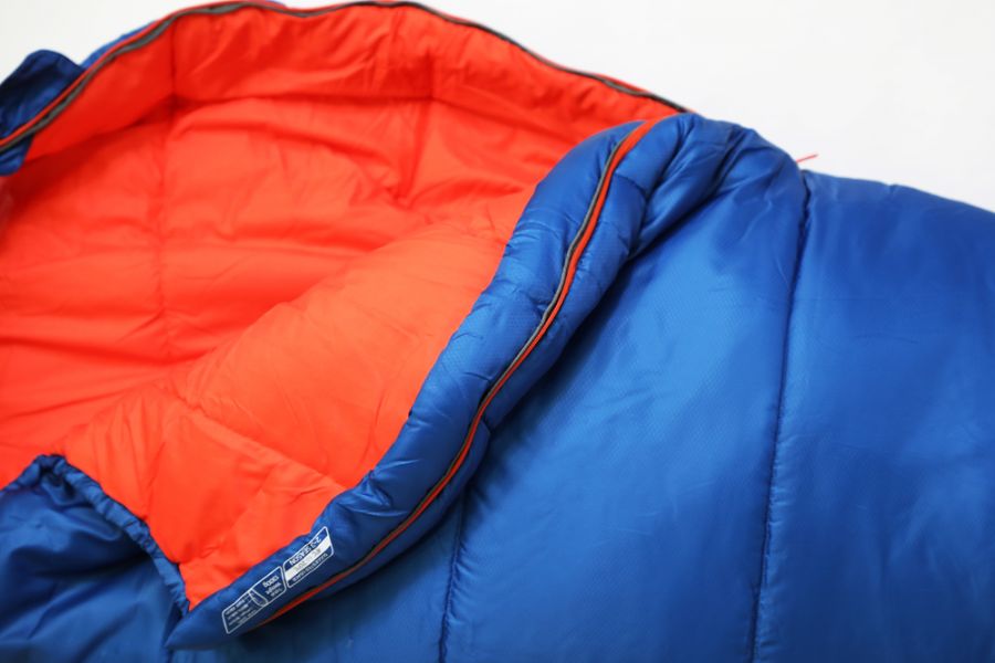 Close up of opening on Vango Nitestar Junior Children's Sleeping Bag in Classic Blue