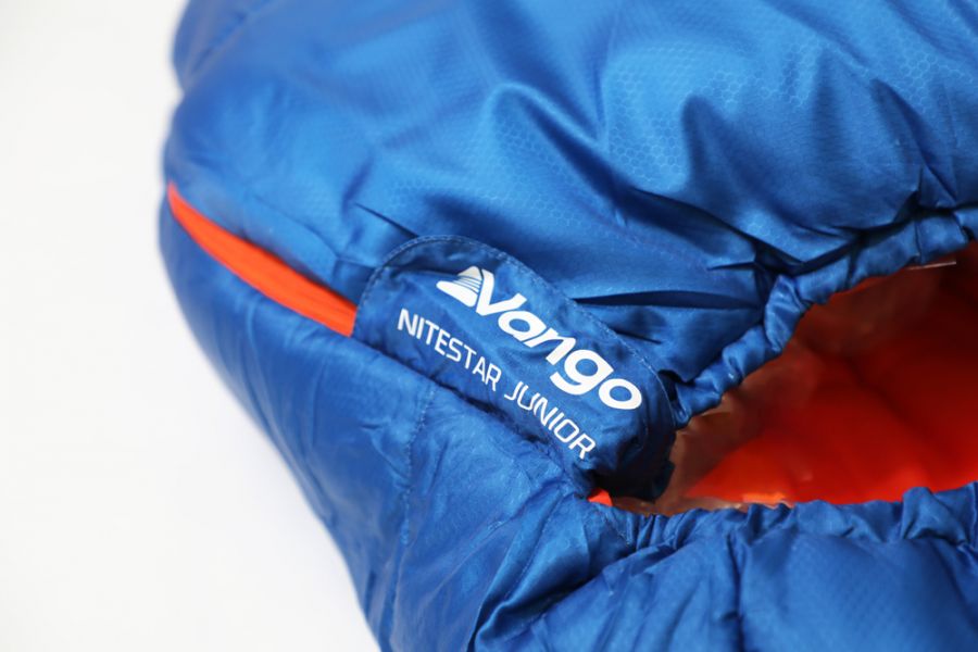 Close up of zip on Vango Nitestar Junior Children's Sleeping Bag in Classic Blue