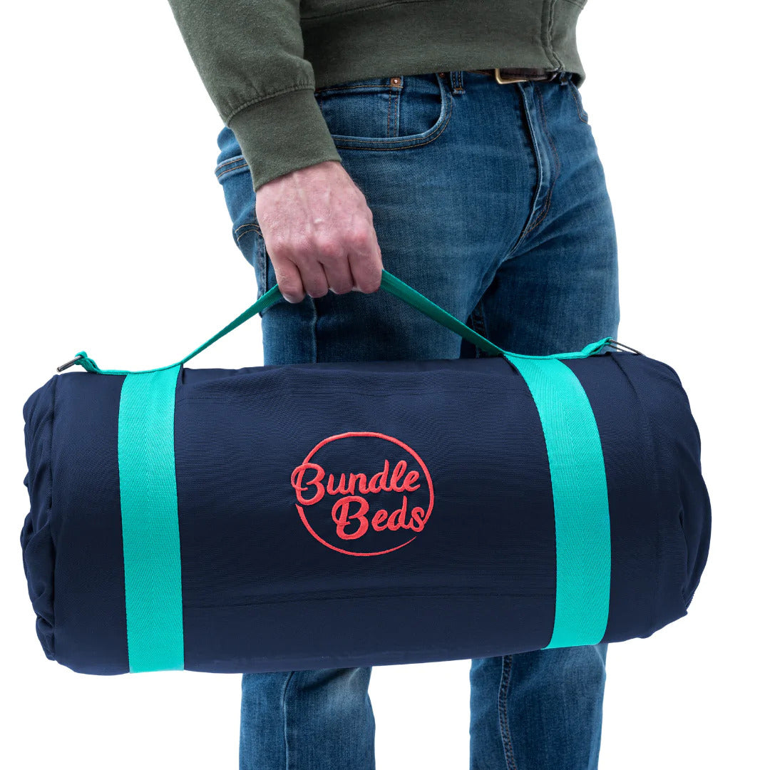 Junior Bundle Bed Camping and Sleepover Bed, in Space Design.  The best camping and sleepover kids bed, Shown being carried.