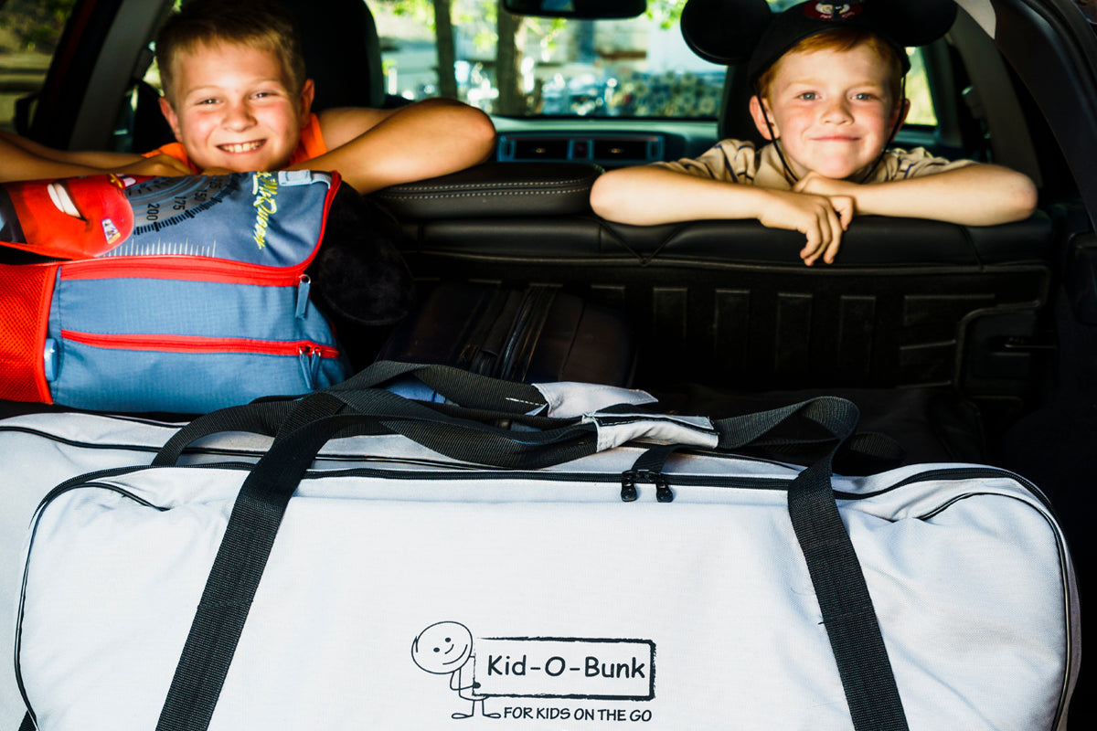Red Kid O Bunk Childrens Camping Bunk Beds shown in car boot