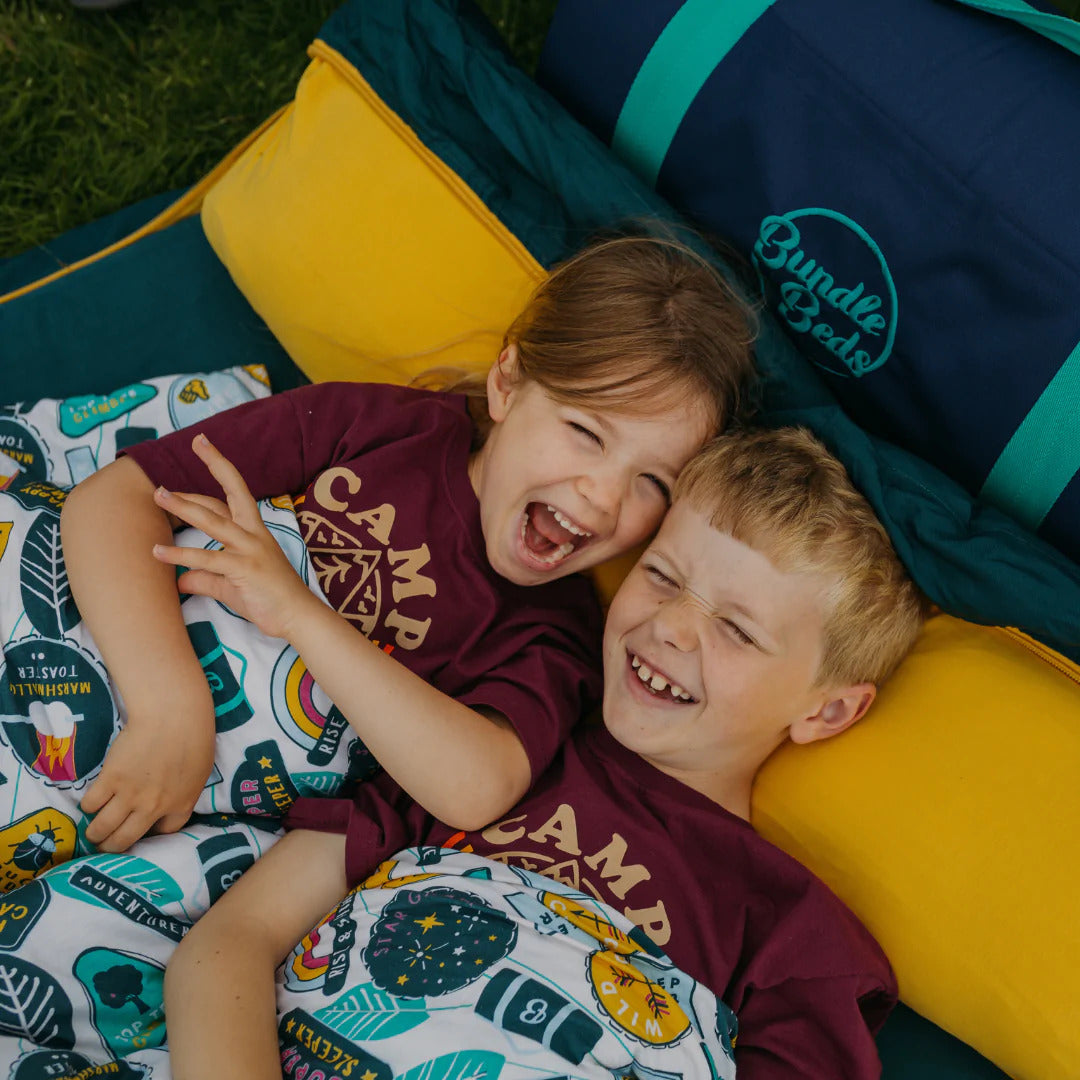 Two kids camping in their Junior Bundle Bed Camping and Sleepover Bed