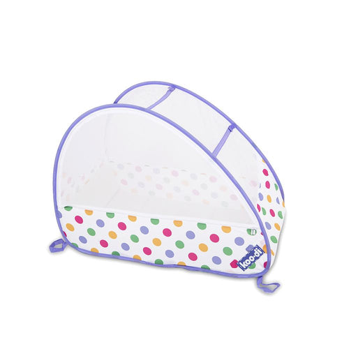 Children's pop-up travel cot in pastel polka dots, from Kids Camping Store, viewed at an angle