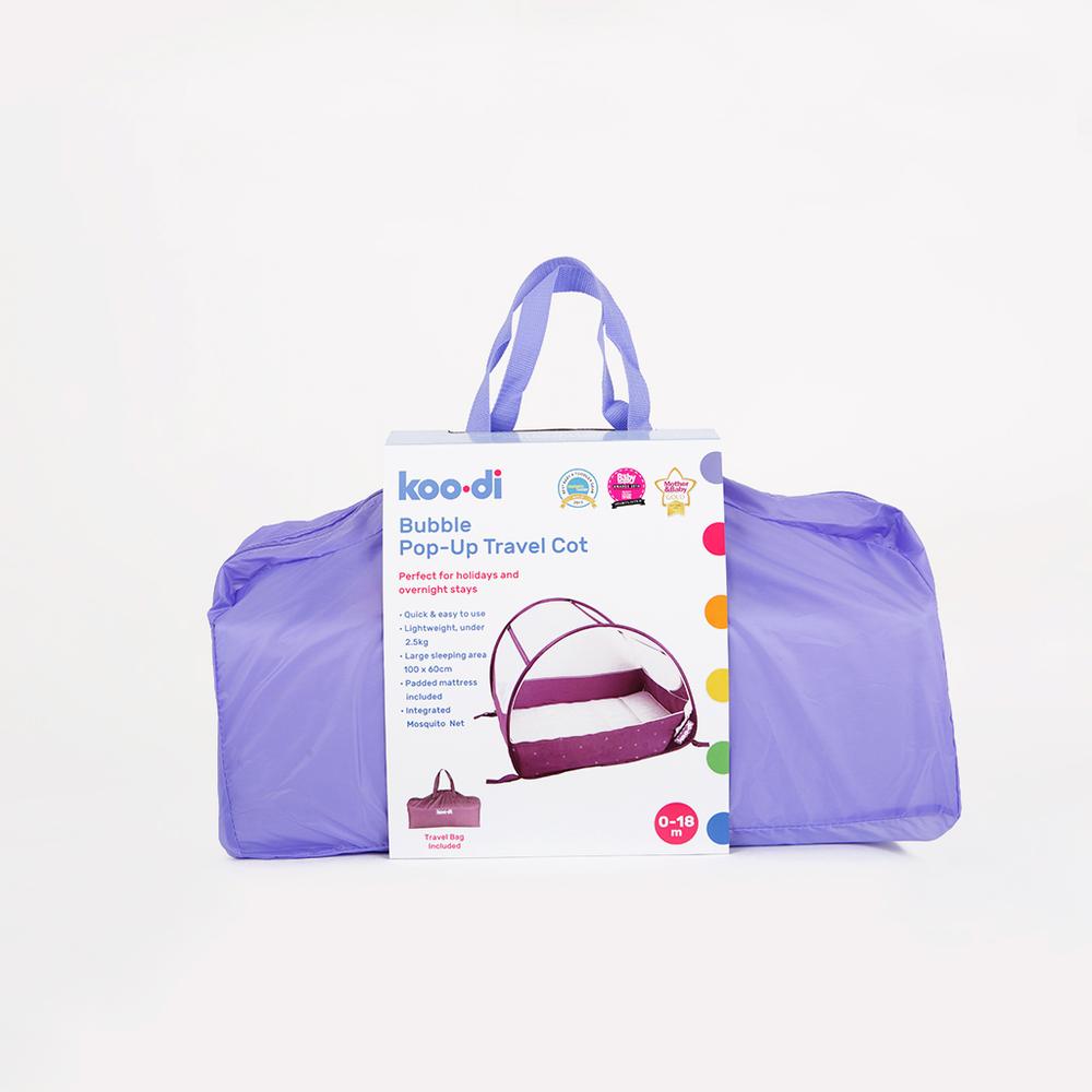 Children's pop-up travel cot in pastel polka dots, from Kids Camping Store in packaging