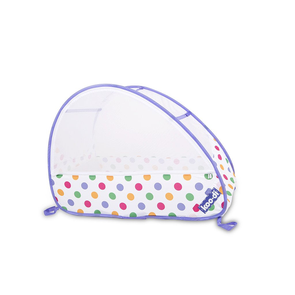 Children's pop-up travel cot in pastel polka dots, from Kids Camping Store