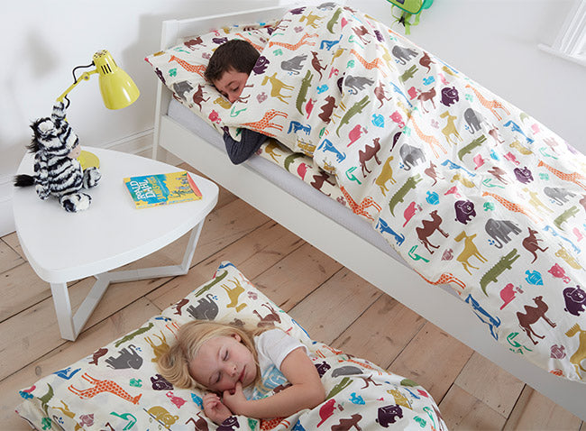 Kids asleep in Dinky Duvalay, Childrens Luxury Camping Bed, at Kids Camping Store