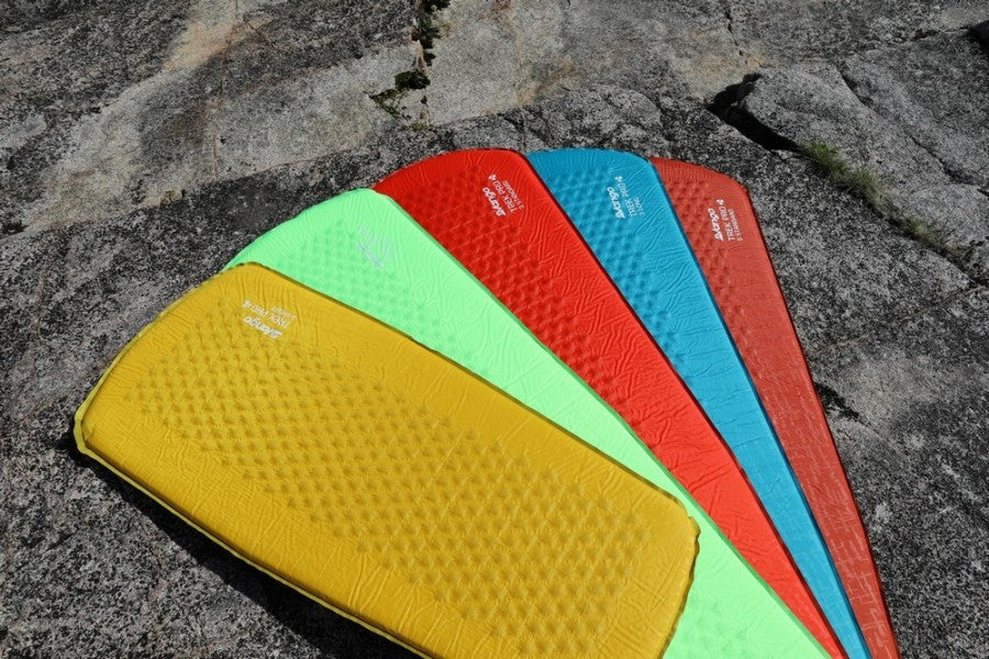 Vango "Trek Pro 3 Standard" 3cm Childrens' SIM in Tango Red (DofE Recommended) laid out with other colours