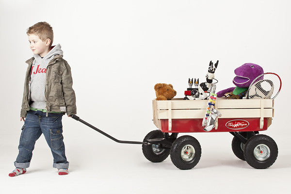 Child pulling Retro Toby Wagon (Festival Trolley) for Children at camping festivals and events, from Kids Camping Store